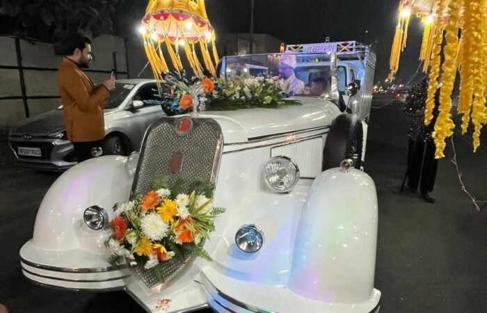 White vintage car, Lucknow wedding, grand entrance, photo moment.