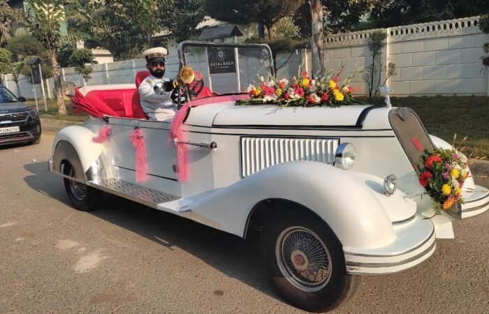 White vintage car, Lucknow wedding, grand entrance, professional chauffeur.