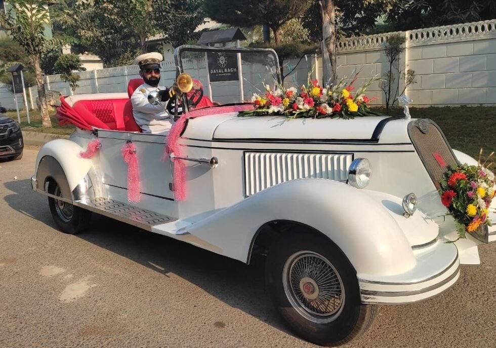 White vintage car, Lucknow wedding, grand entrance, professional chauffeur.