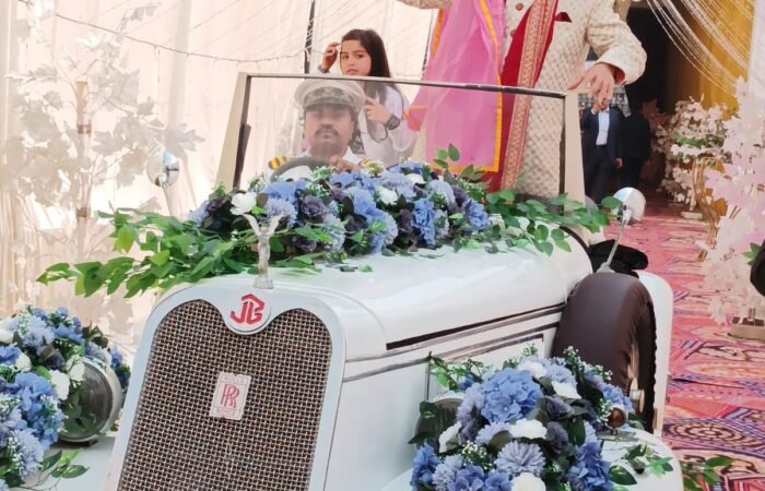 White vintage car, Lucknow wedding, grand entrance, photo moment.
