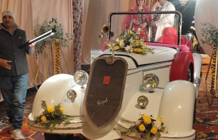 Bride and groom in white vintage car, Lucknow.