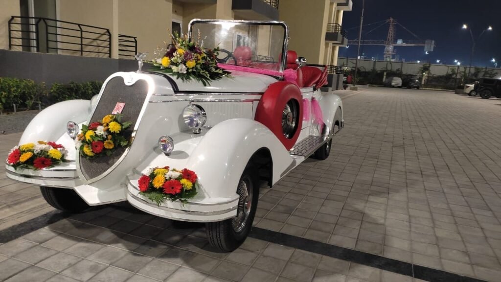Decorated white vintage car, Lucknow wedding venue.
